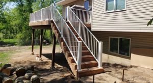 12 x 20 Brown Treated Wood Deck Built By Thunderstruck Restorations LLC In Ham Lake, MN.