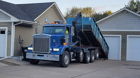 Dumpster used to dispose of old roofing shingles